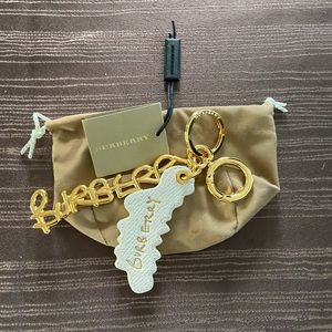 Brand New $285 Burberry leather gold white keychain key fob for purse bag